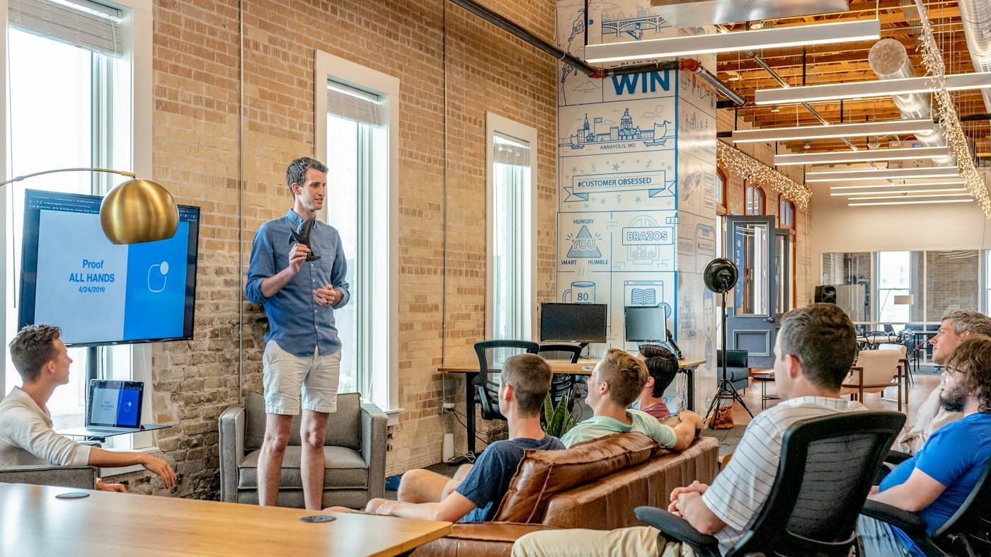 Team members gathered in a modern office during a presentation