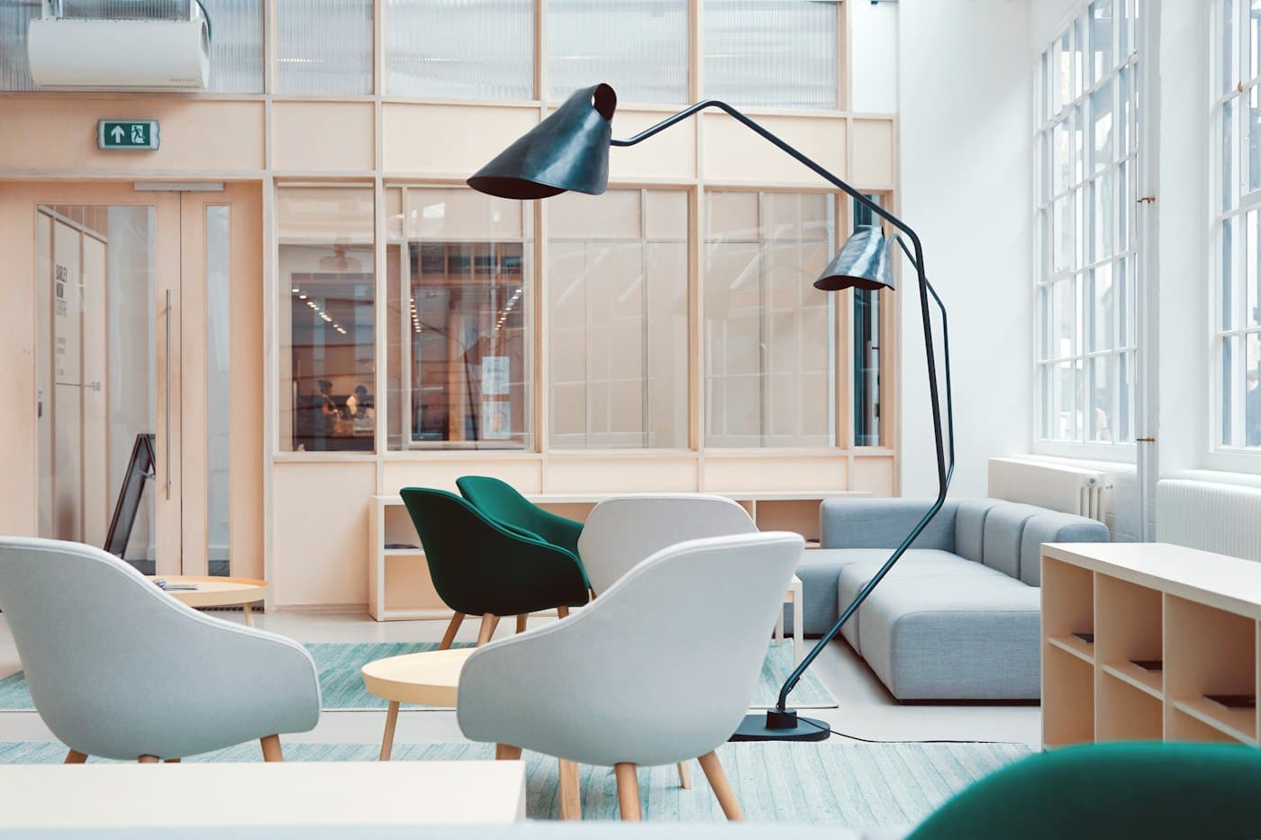 Bright, plant-filled office lounge with comfortable seating