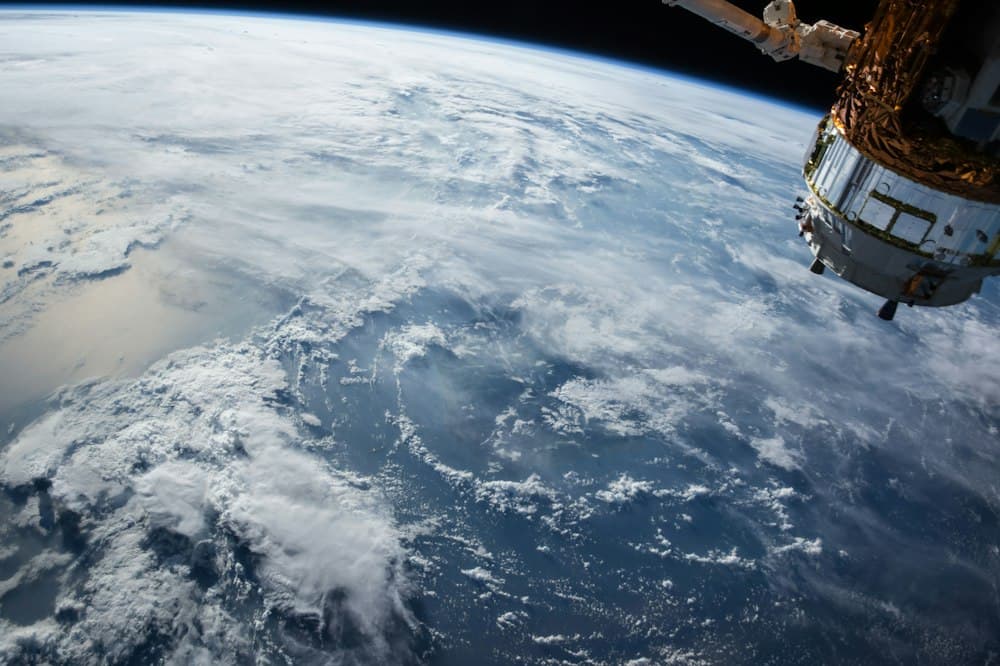 Earth viewed from orbit with clouds over the ocean