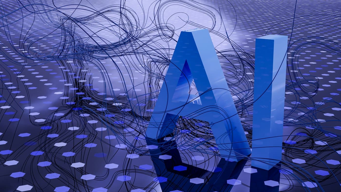 Three-dimensional letters spelling AI on a digital background